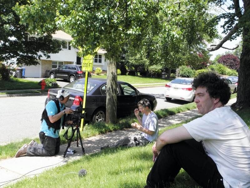 John Cooley being interviewed by the New York Times in Metuchen with David Rothenberg in the foreground